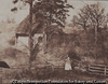Wife of W. R. Baker by the Summerhouse
