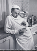 Dr. Ceriani resting in his kitchen, after having spent the night operating. Kremmling, Colorado, USA. 1948