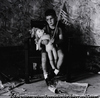 Seated Boy with Flag and Doll