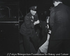 Policeman Putting Woman into Car