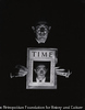 (Man holding TIME in the dark)