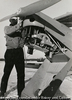 (Man who is servicing airplane)