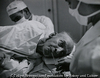 Thomas Mitchell, who has gangrene in his foot, being operated on by Dr. Ceriani. Kremmling, Colorado, USA. 1948.