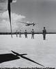 Military Police 11th Airborne Division wait the landing in Okinawa of the Japanese surrender plane, August 19, 1945