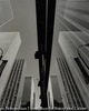 Office buildings on 6th Avenue reflected in a window pane